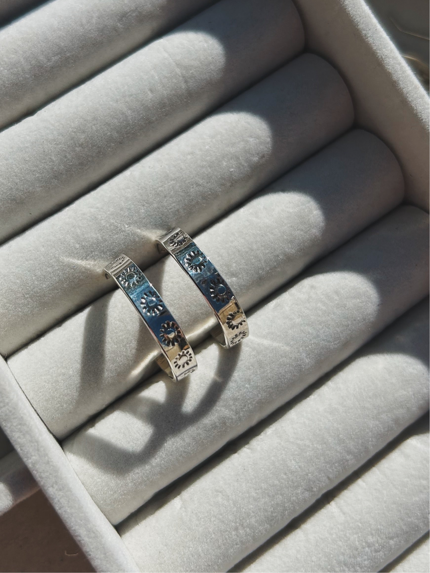 Sunburst stamped silver hoops