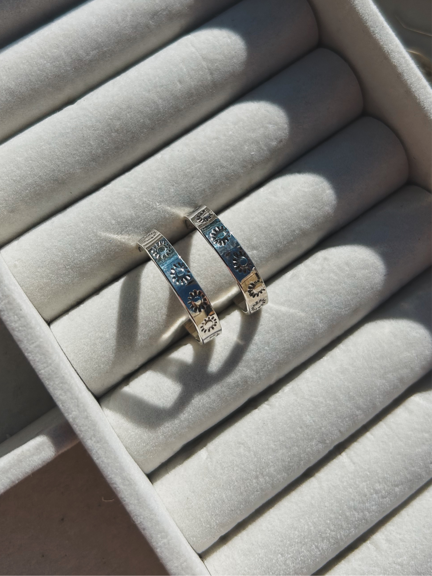 Sunburst stamped silver hoops