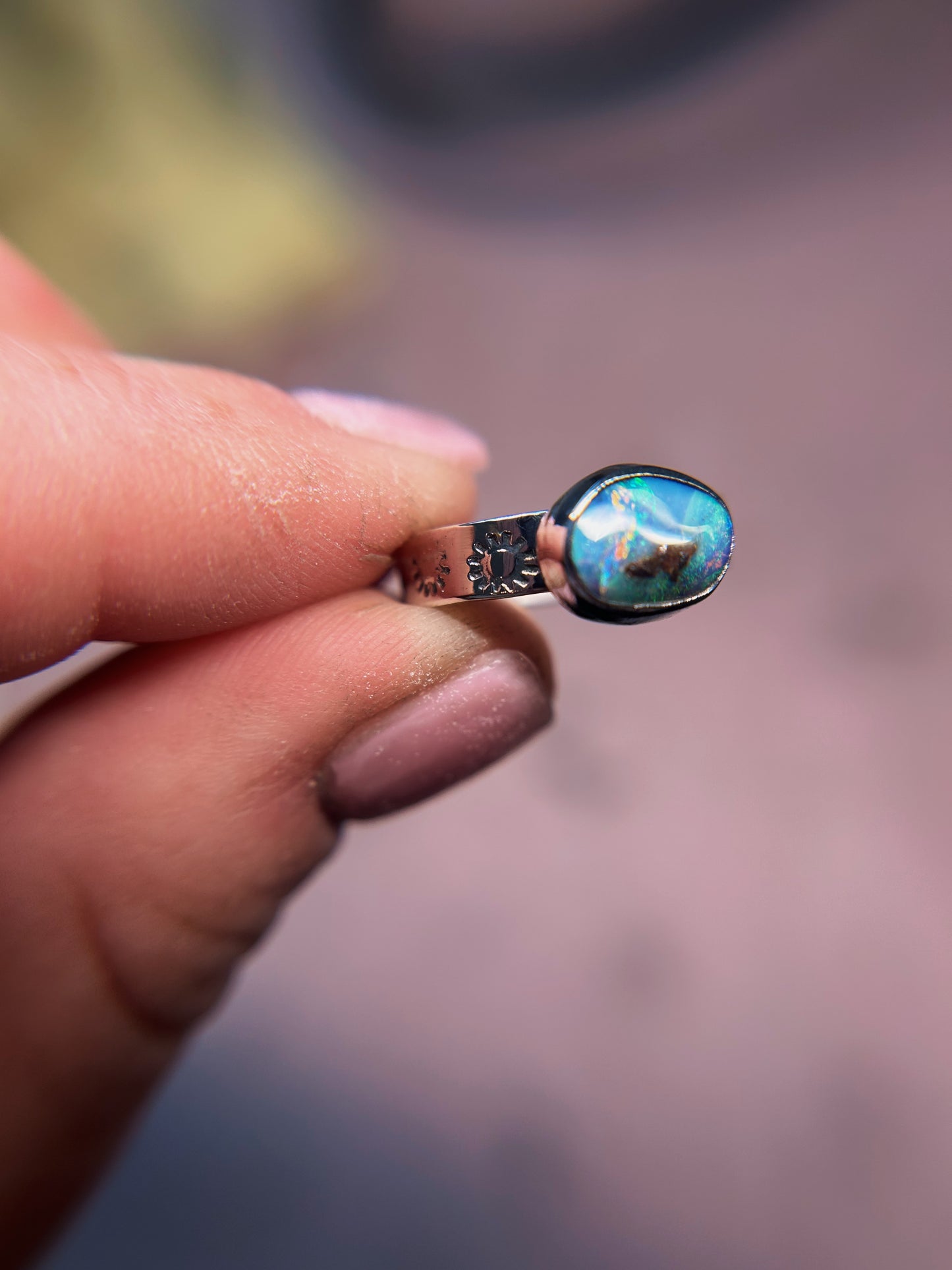 Petite size 5 boulder opal ring with sunburst band