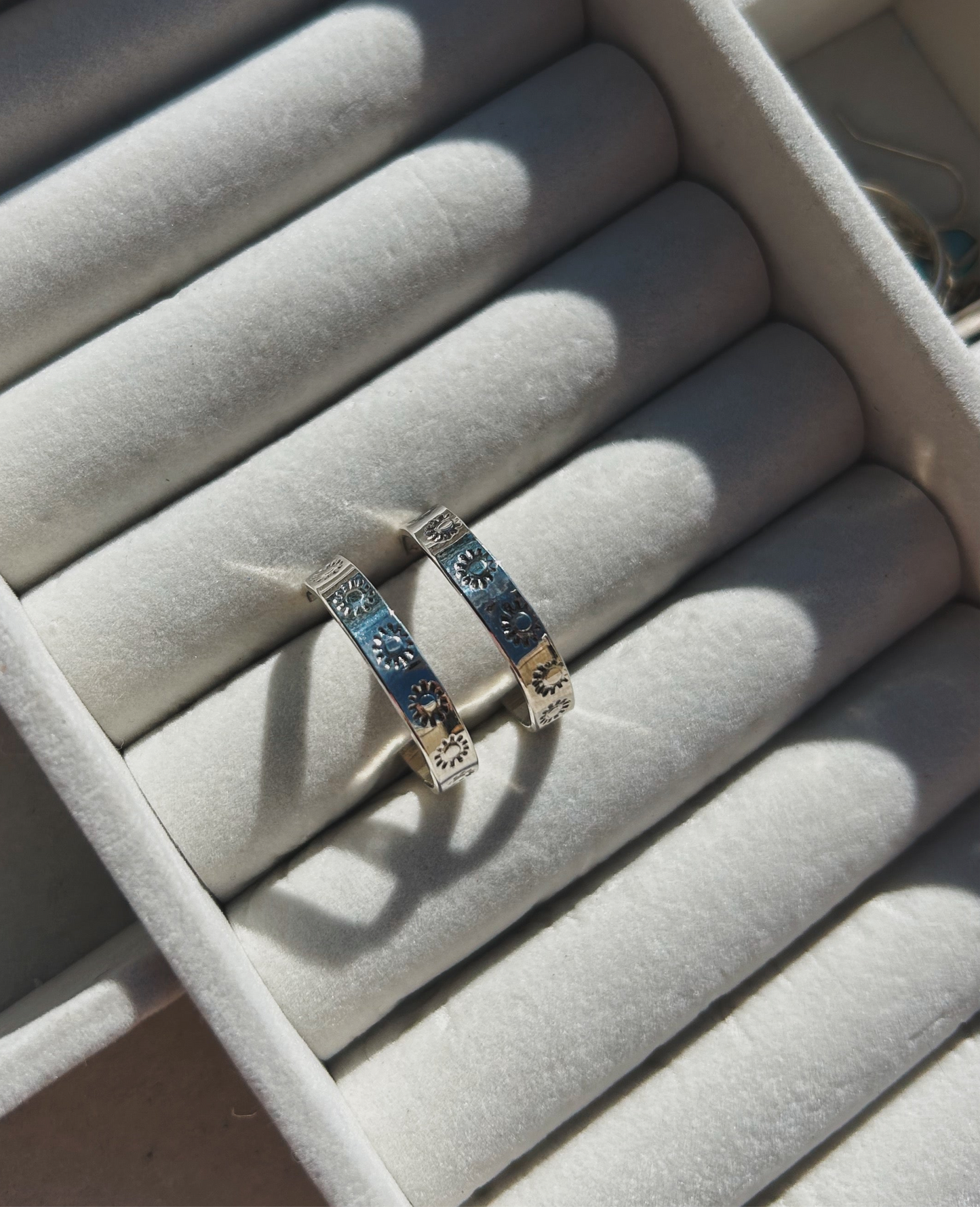 Sunburst stamped silver hoops