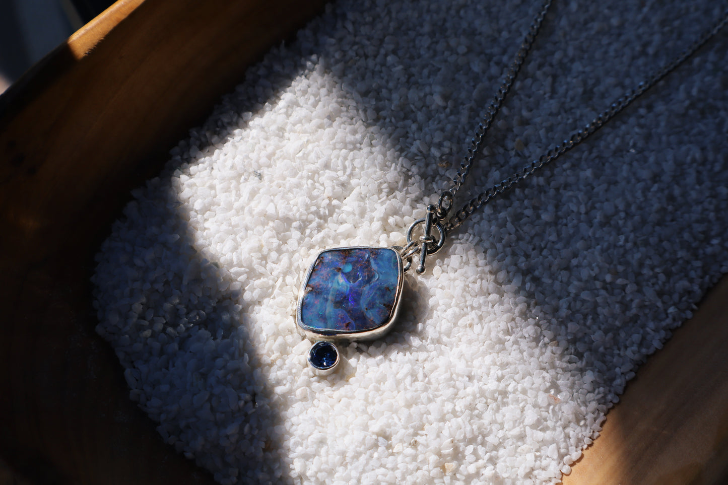 Large Blue boulder opal pendant and stunning blue Sapphire. 15in toggle clasp.