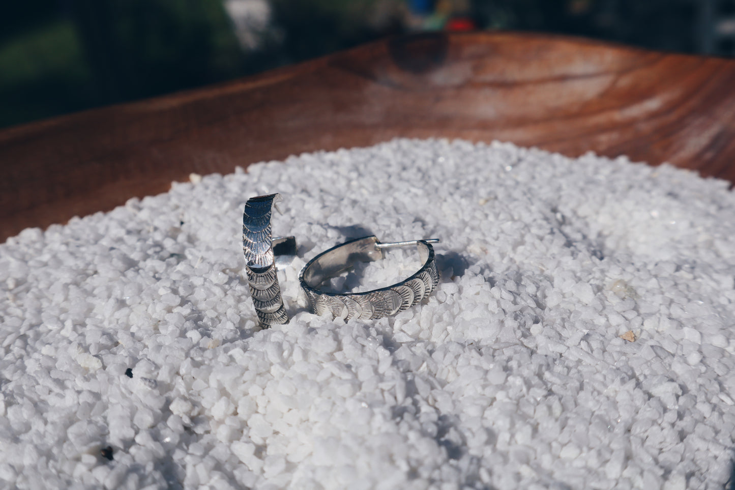 Hand stamped sterling silver “Fish tail” hoop earrings.
