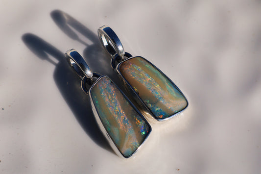 Flashy matching pair of pink swirl boulder opal huggie earrings. Sterling.