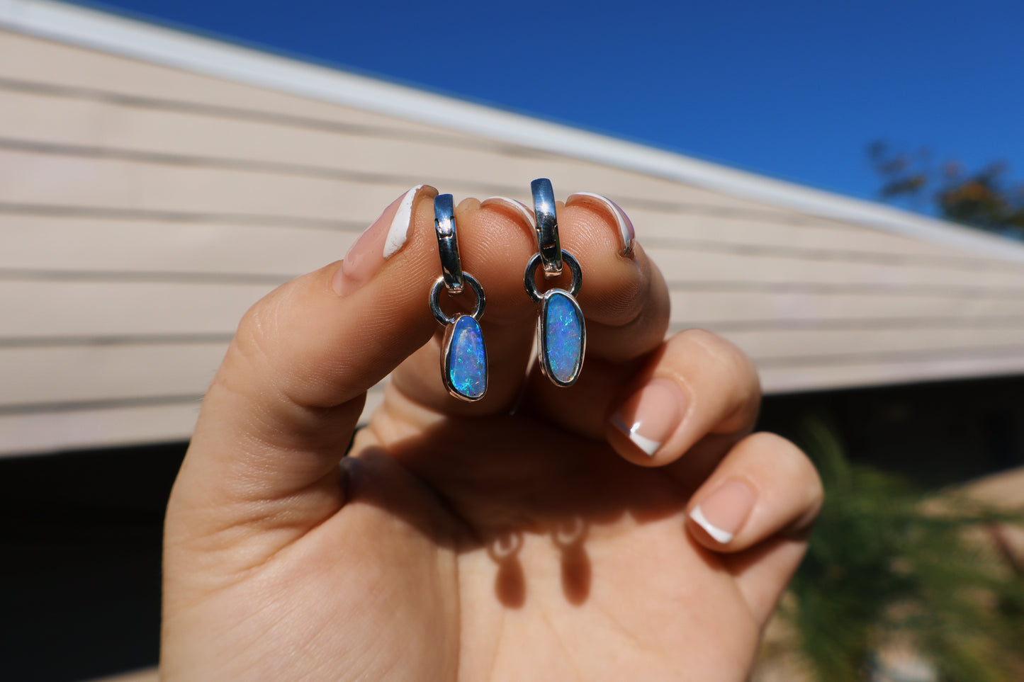 Crystal opal pair of huggie hoop earrings