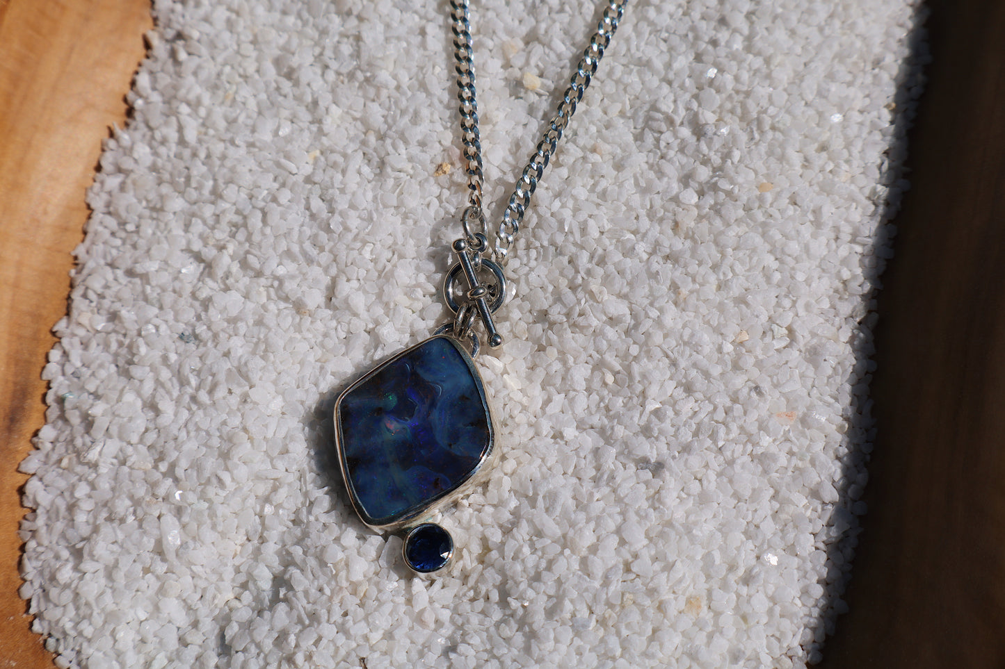 Large Blue boulder opal pendant and stunning blue Sapphire. 15in toggle clasp.