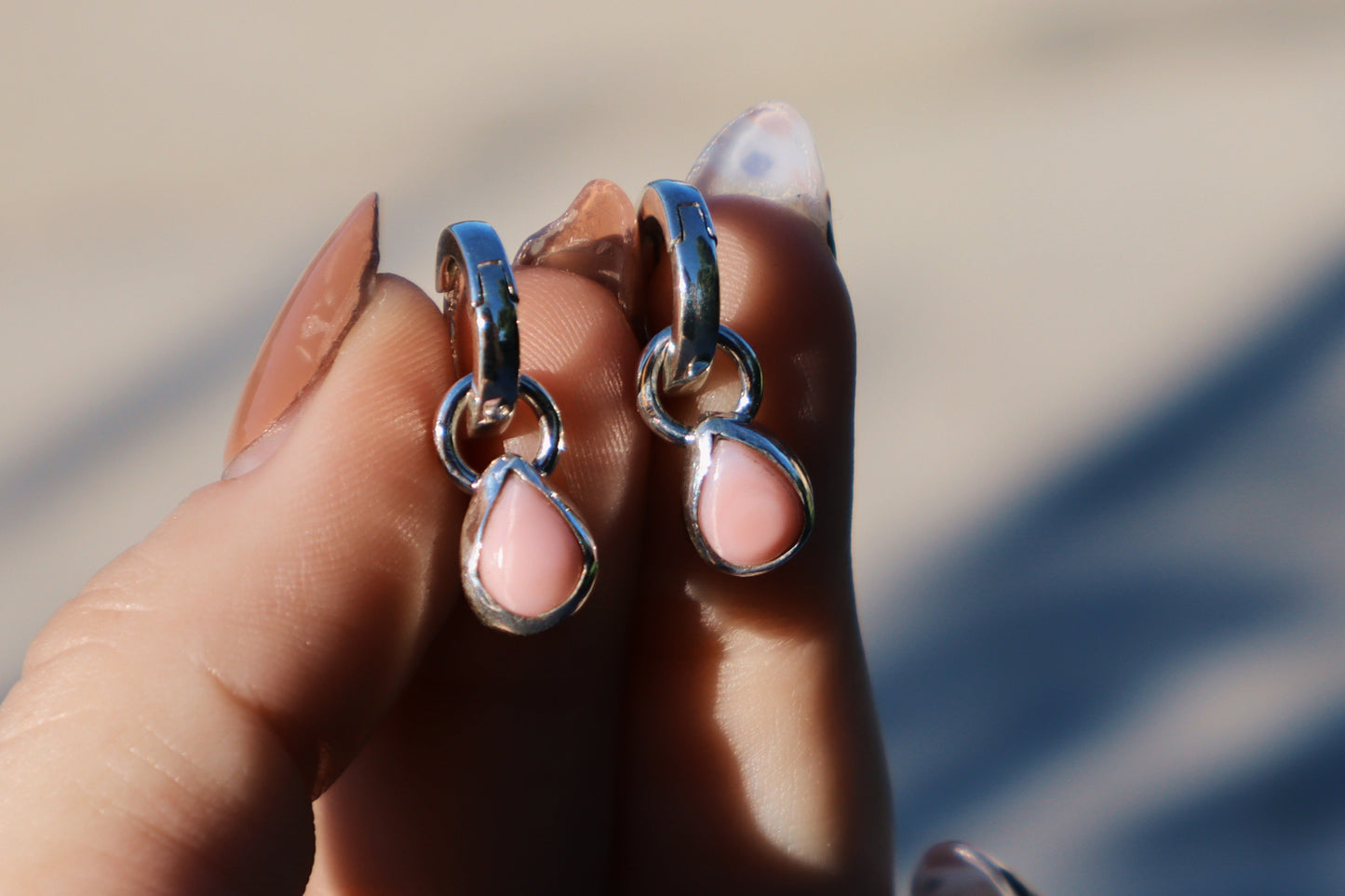 Pink conch huggie hoops