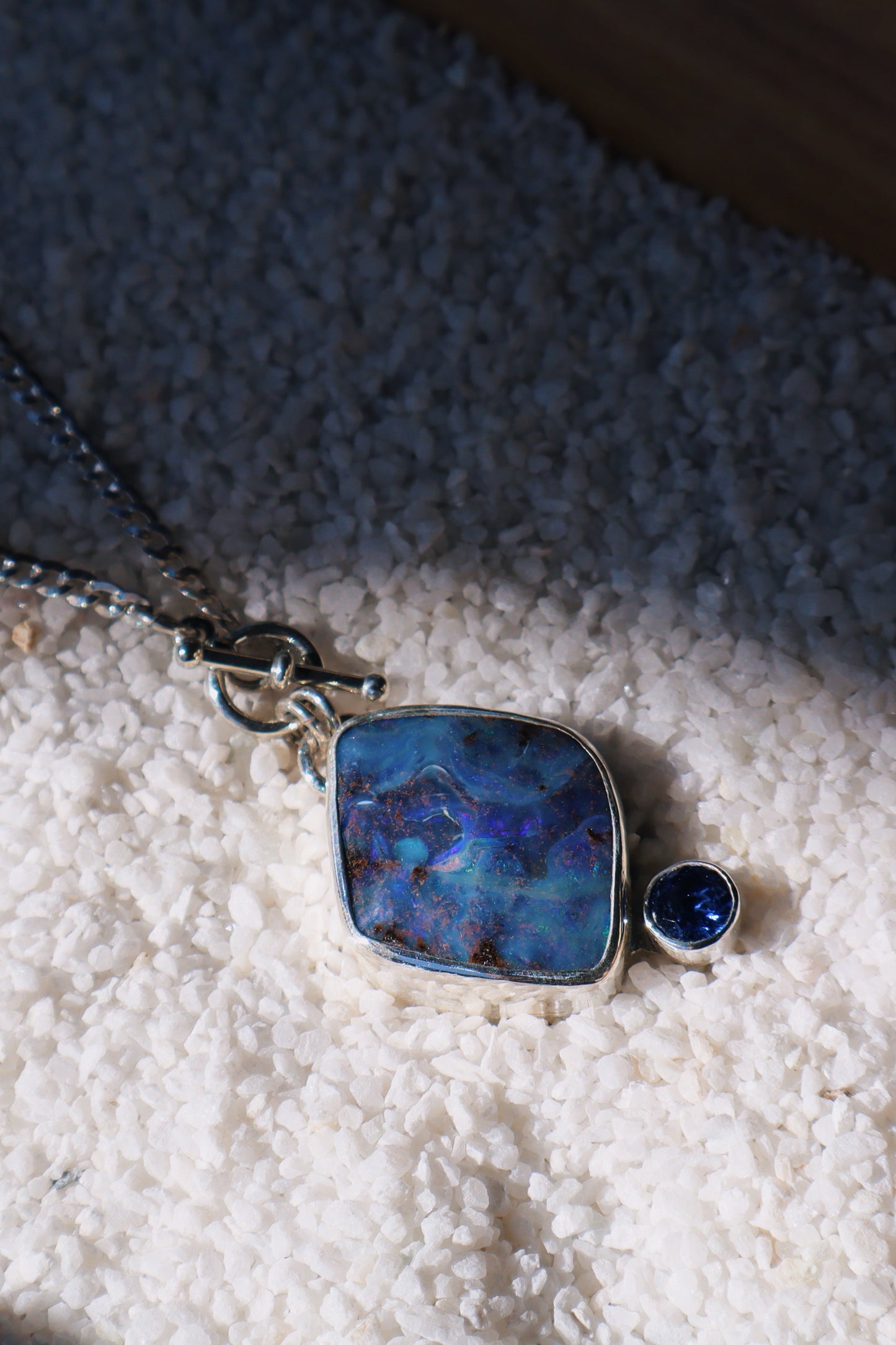 Large Blue boulder opal pendant and stunning blue Sapphire. 15in toggle clasp.