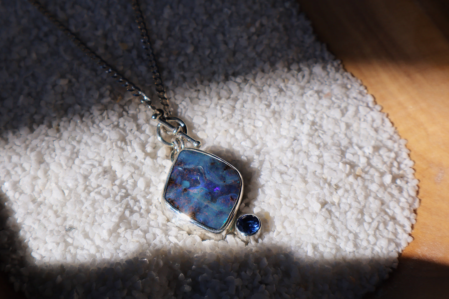 Large Blue boulder opal pendant and stunning blue Sapphire. 15in toggle clasp.