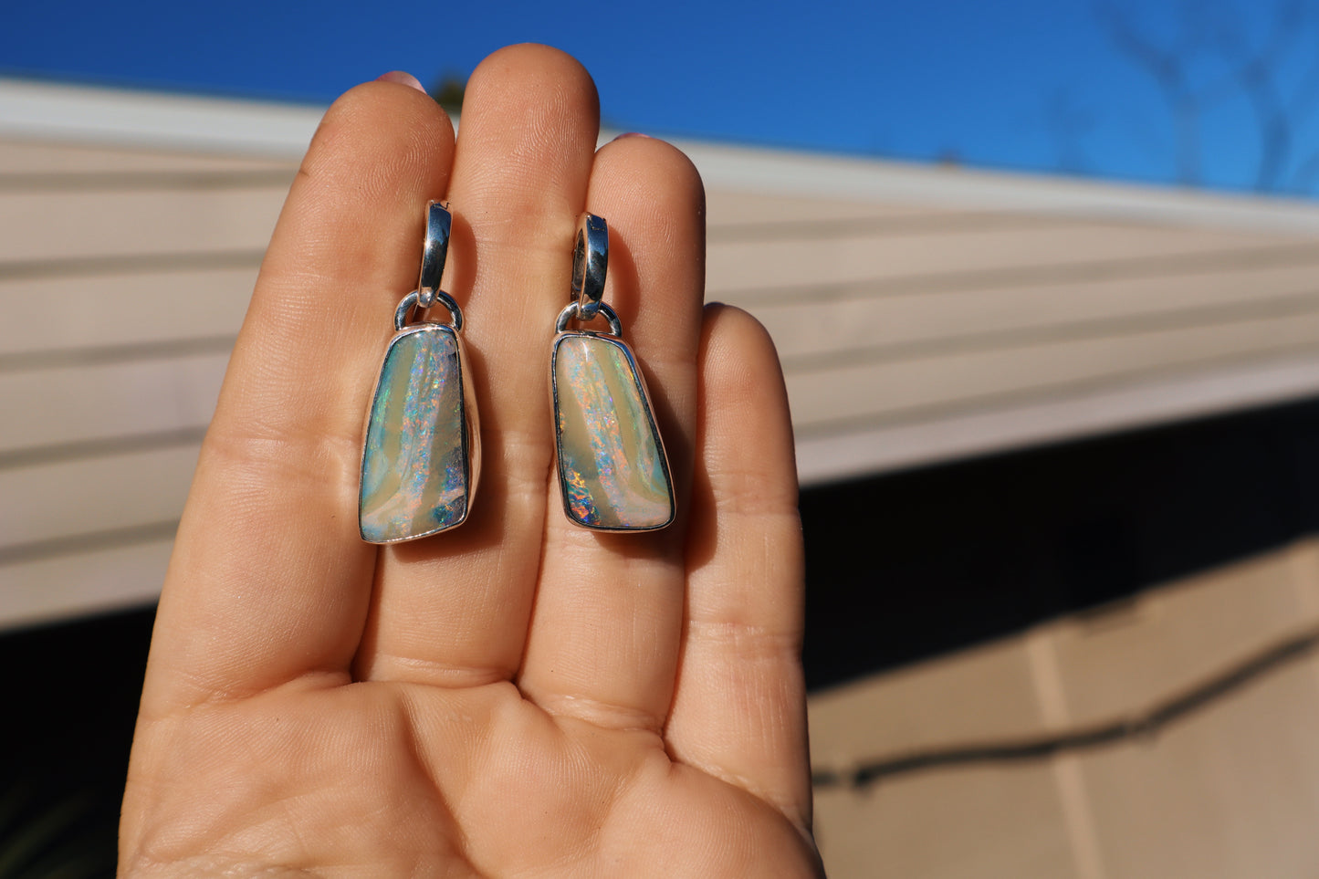 Flashy matching pair of pink swirl boulder opal huggie earrings. Sterling.