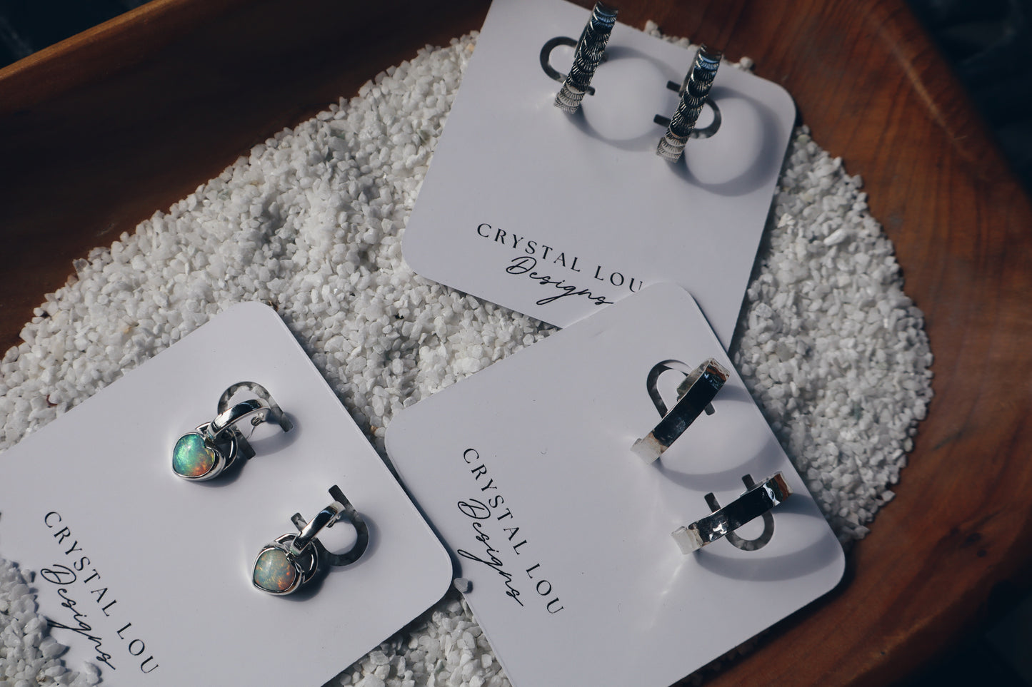 Hand stamped sterling silver “Fish tail” hoop earrings.