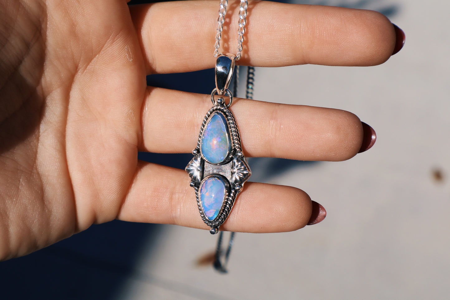 Stunning double purple opal pendant, 18in flat curb chain, hand forged accents.