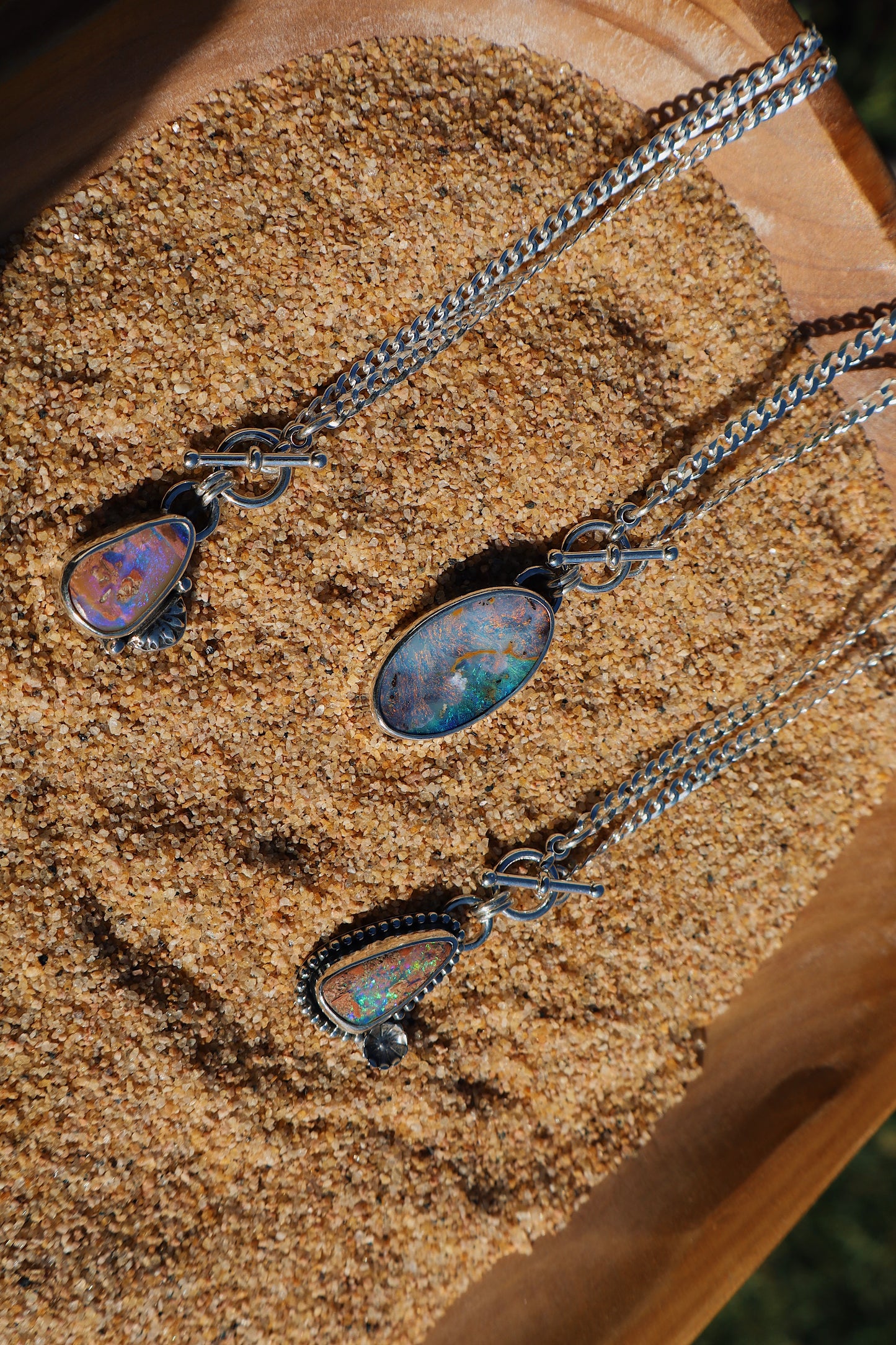 Sparkly green boulder opal toggle pendant with beaded and floral accents. 18in flat curb chain. Sterling silver.