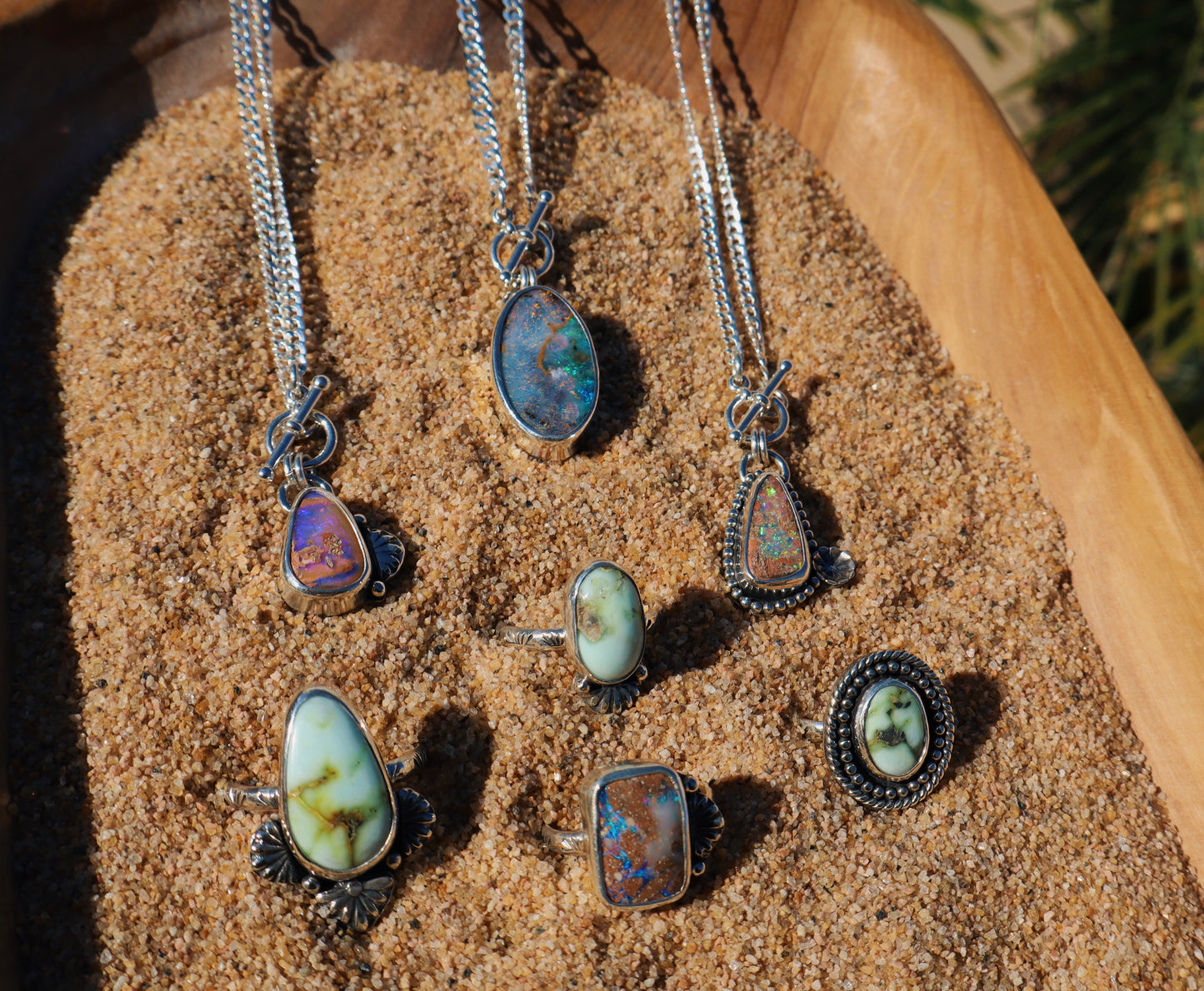 Sparkly green boulder opal toggle pendant with beaded and floral accents. 18in flat curb chain. Sterling silver.