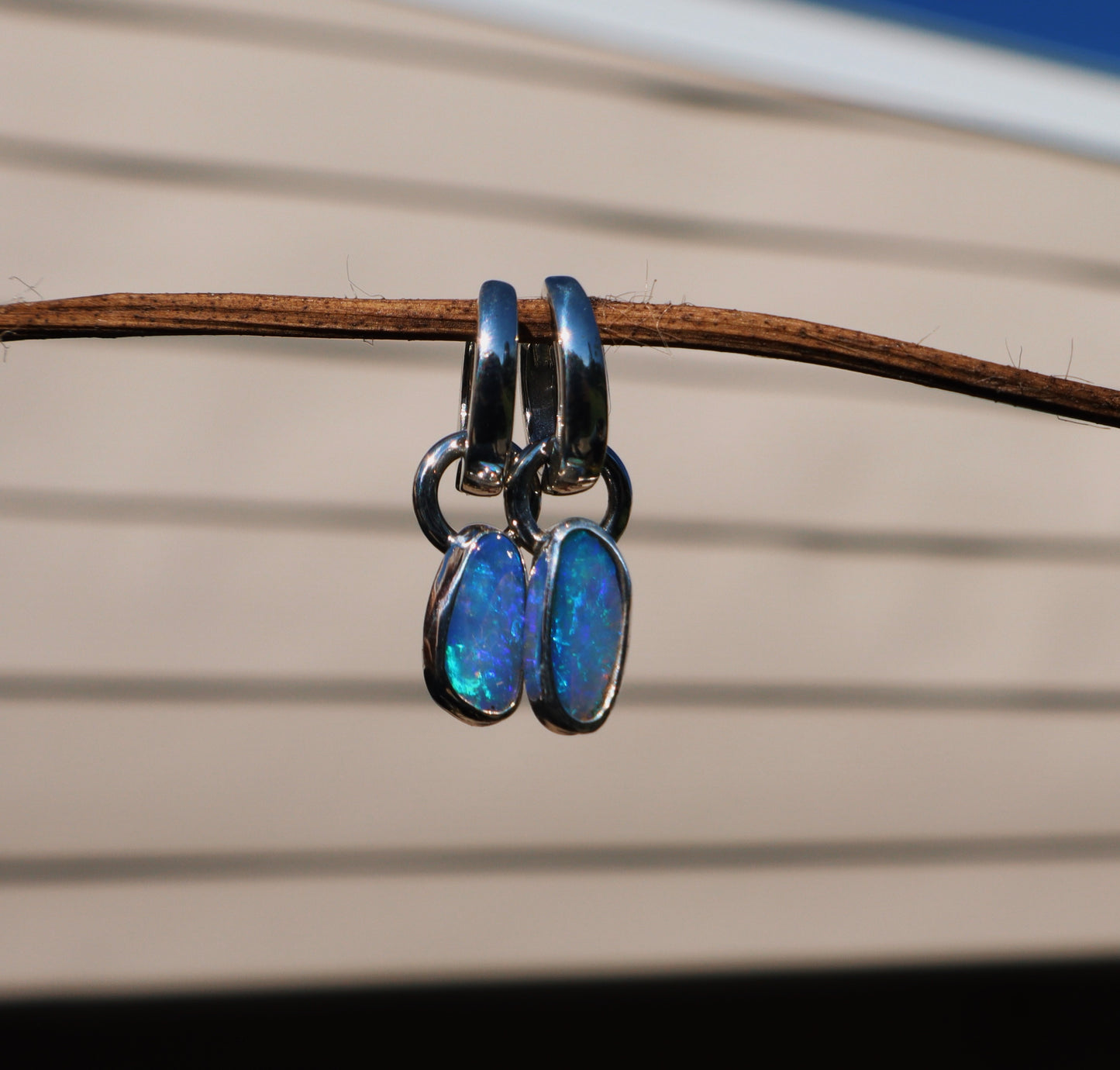 Crystal opal pair of huggie hoop earrings